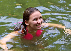 camper demonstrating her swimming ability