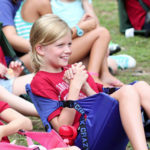 Camper girl giggles at assembly