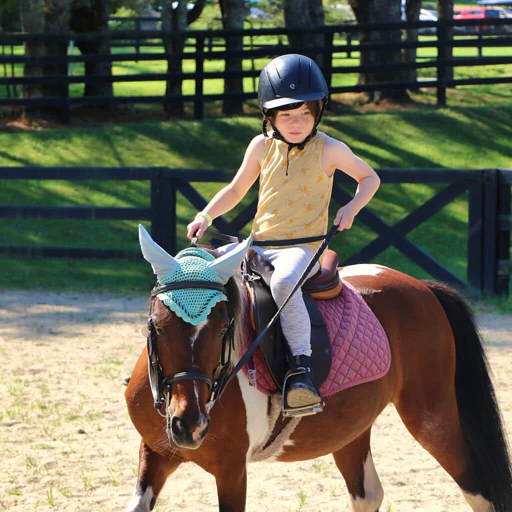 Small summer camp horse rider