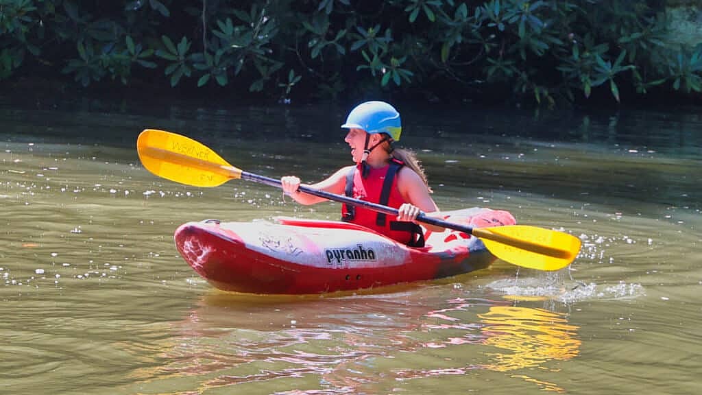 summer camp girl kayaking