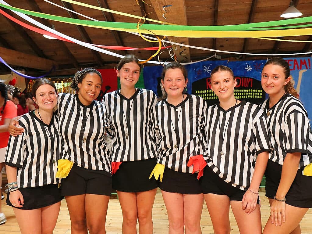 Camp counselors dressed as refs