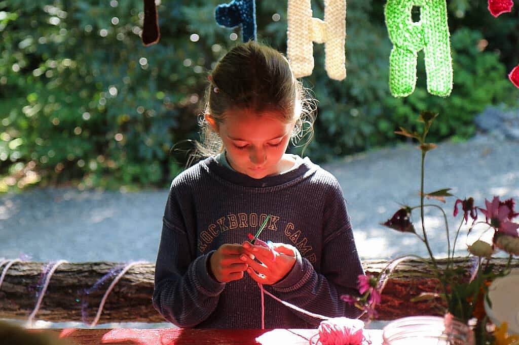 camp girl knitting