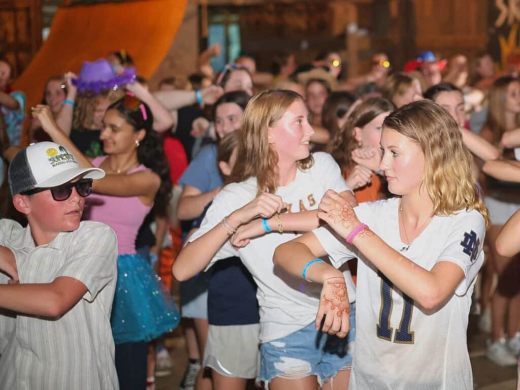 girls and boys campers dancing