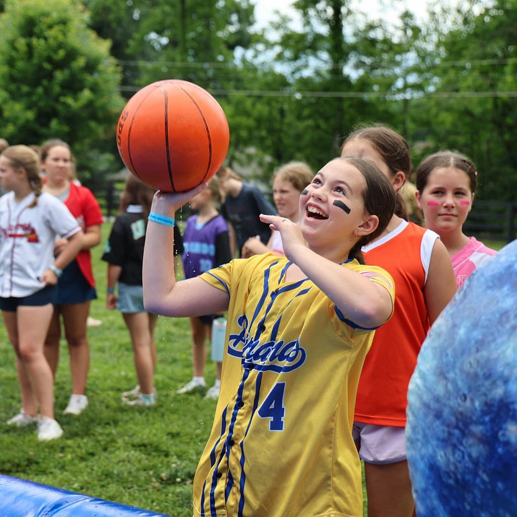 camper shooting basketball