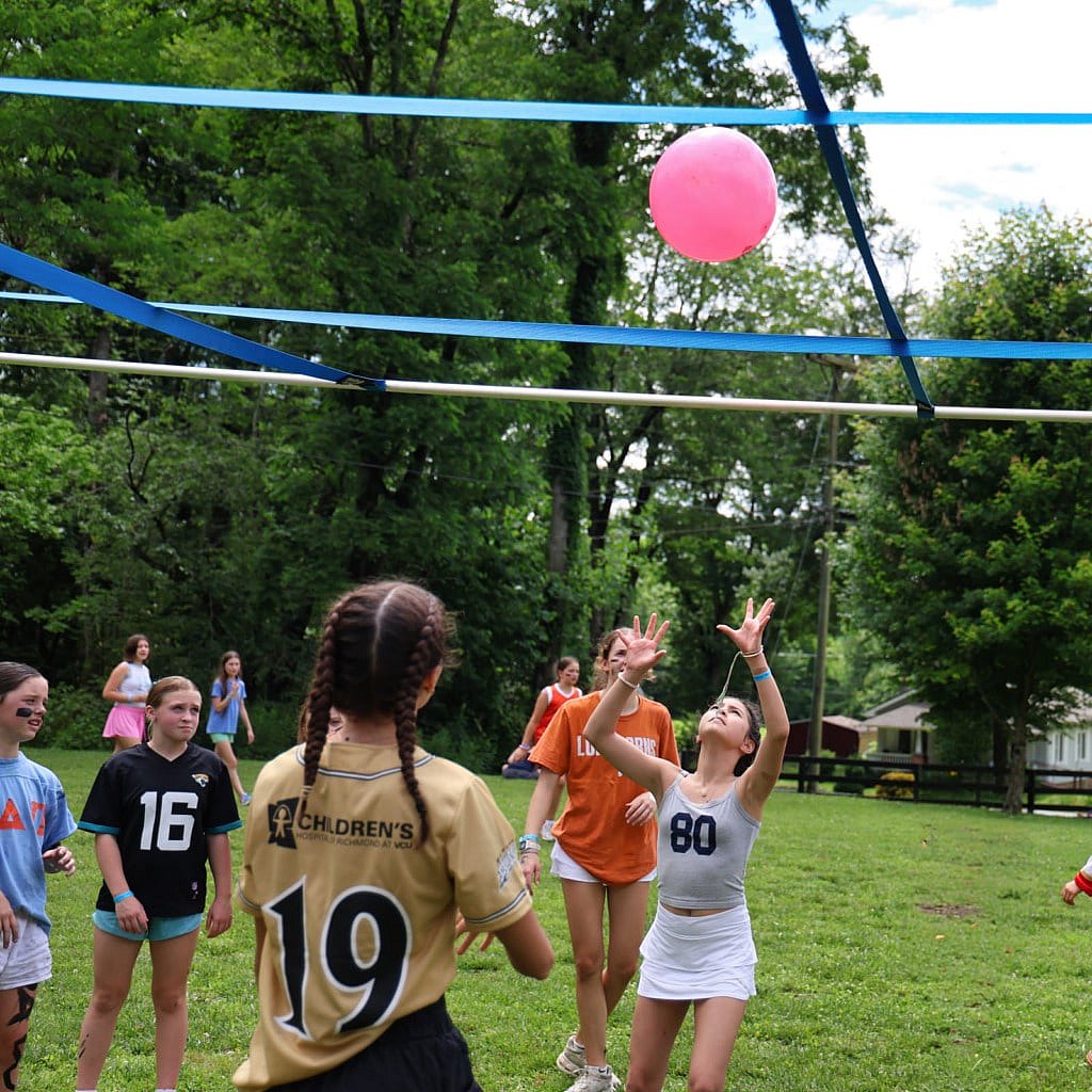 girls playing nine square in the air