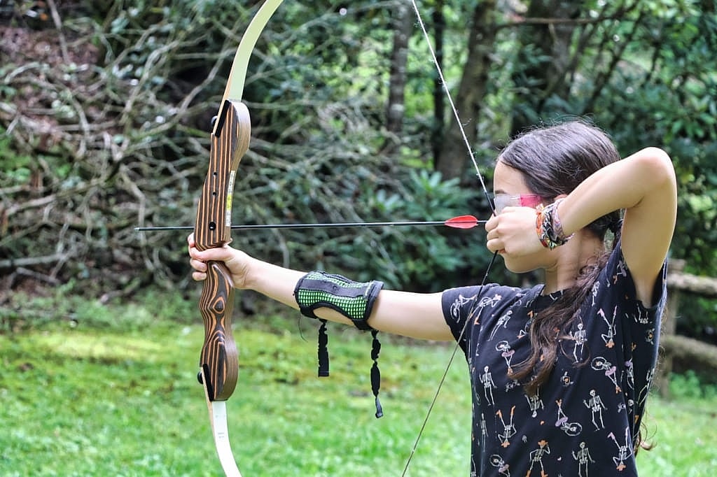 camp grils aiming archery