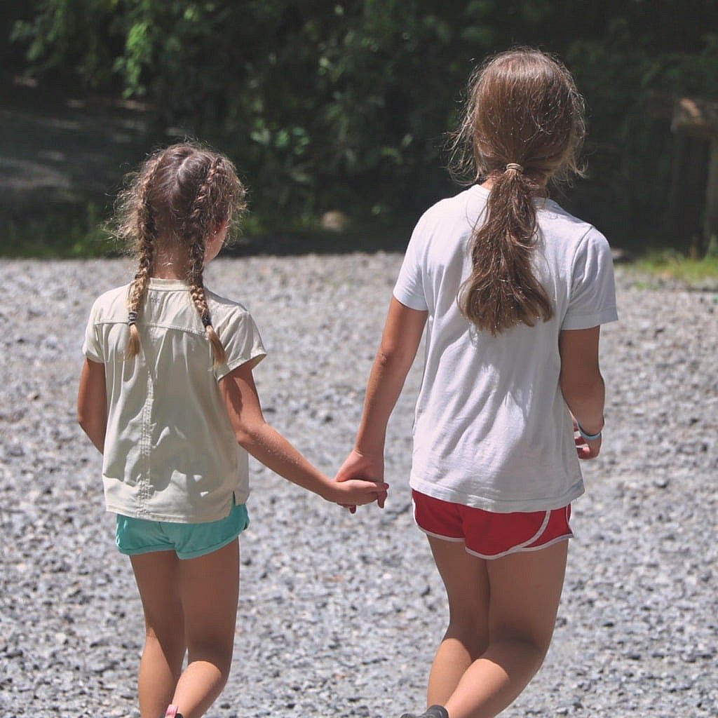 camp girls holding hands