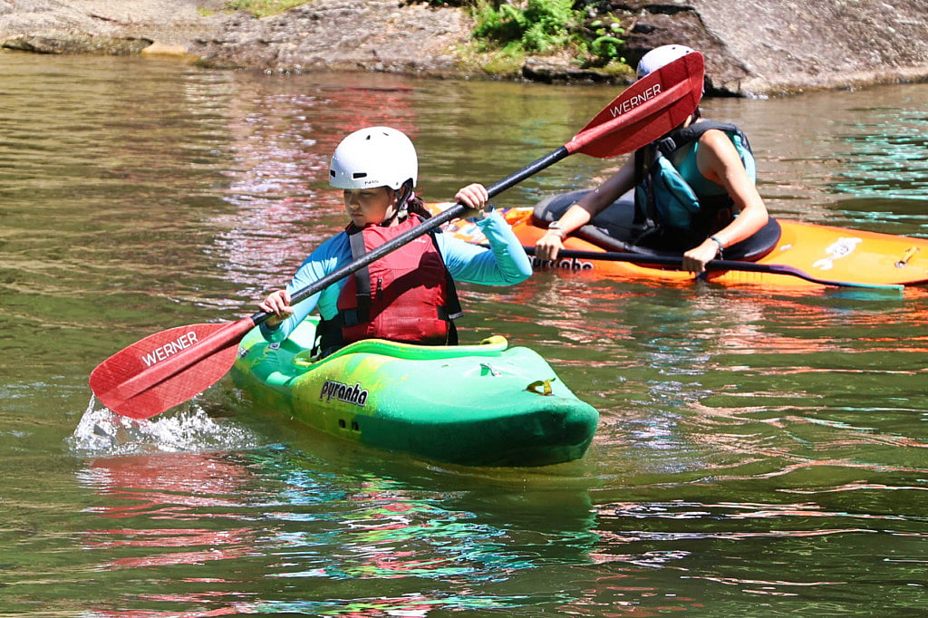 learning to kayak at summer camp