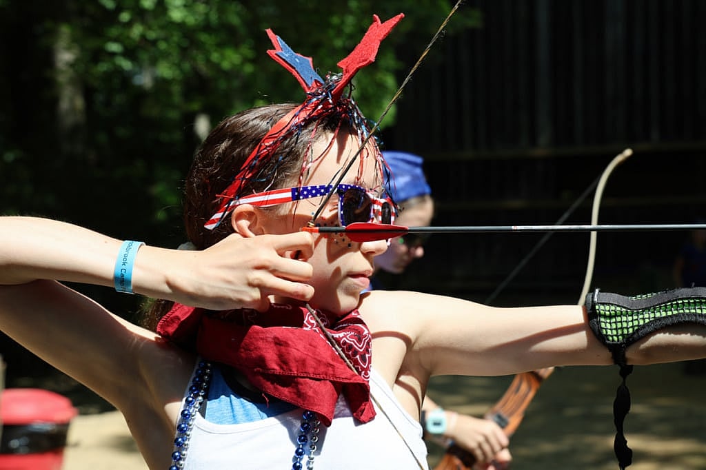 red white and blue archery girl