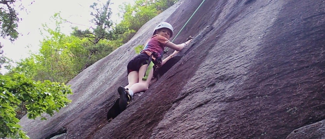 camp girl rock climbing