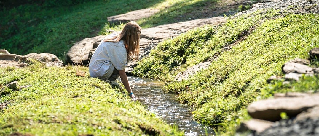 camp child nature stream explorinf