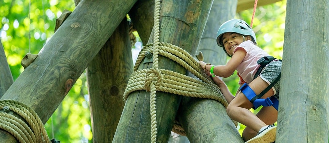 camp girl with high moxie climbing