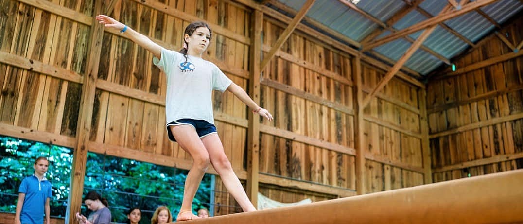 camp girl balance beam gymnastics class