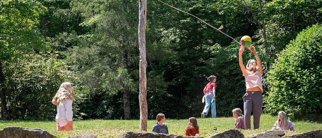 summer camp kids playing tetherball