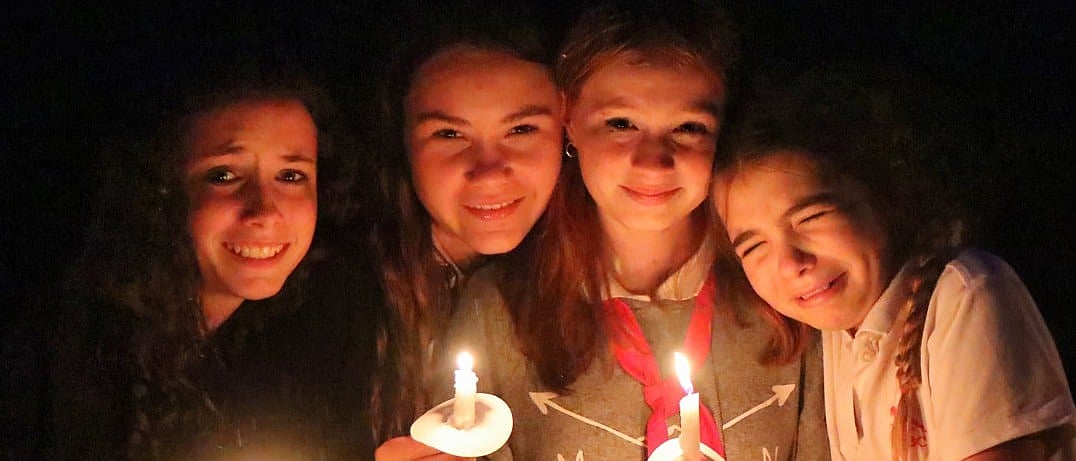 camp girls holding candles