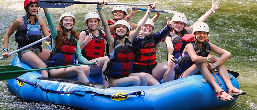 teenage camp girls rafting