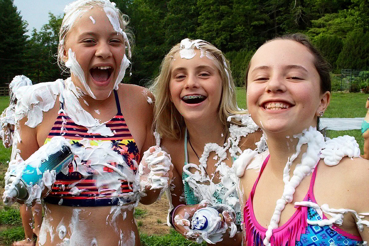 Camp girls shaving creamed