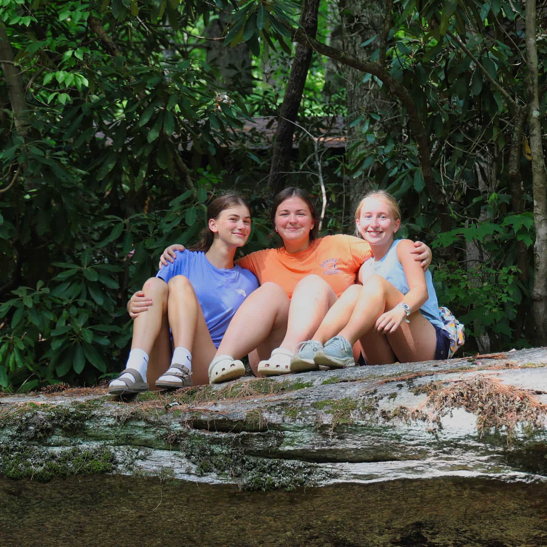 3 sitting camp friends