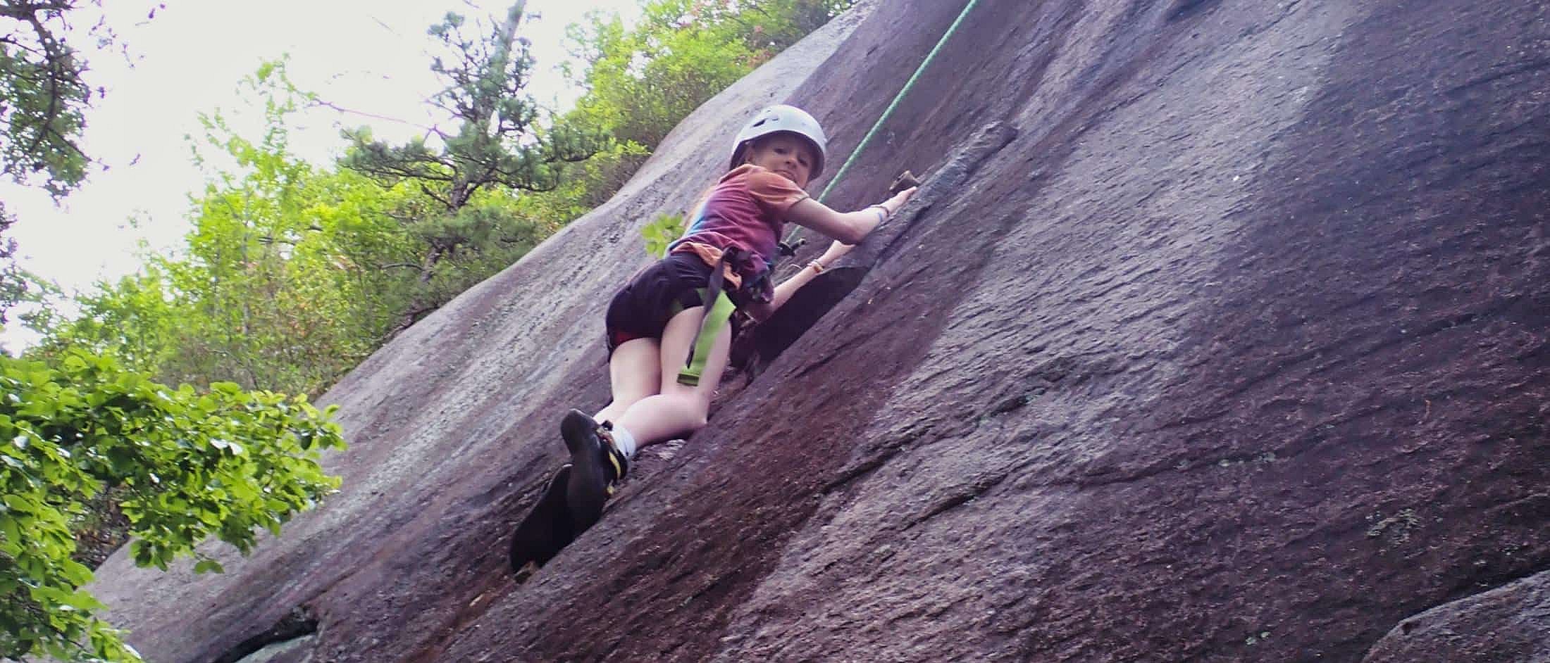 camp girl rock climbing