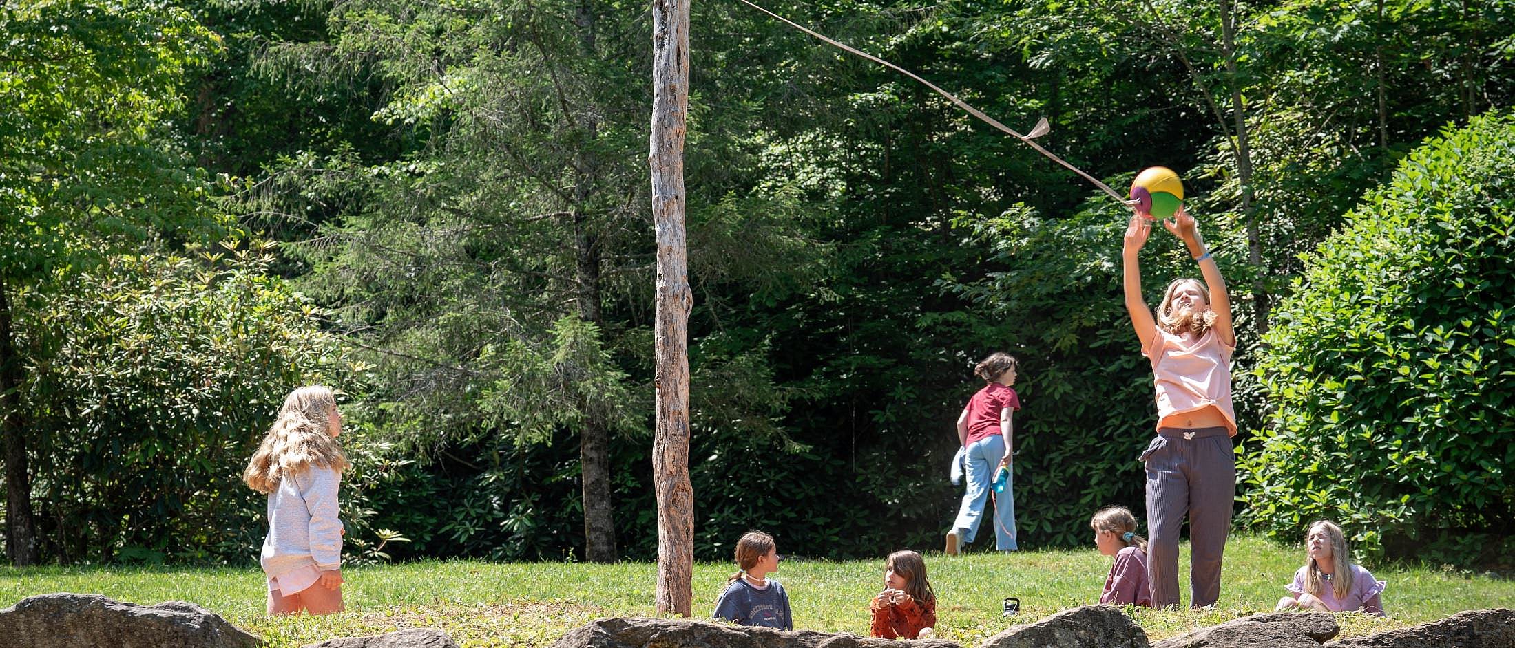 summer camp kids playing tetherball
