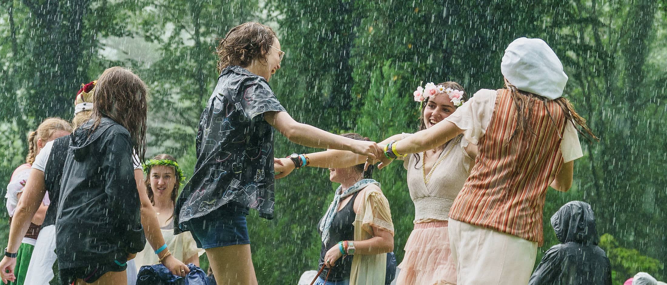 girls dancing in the rain