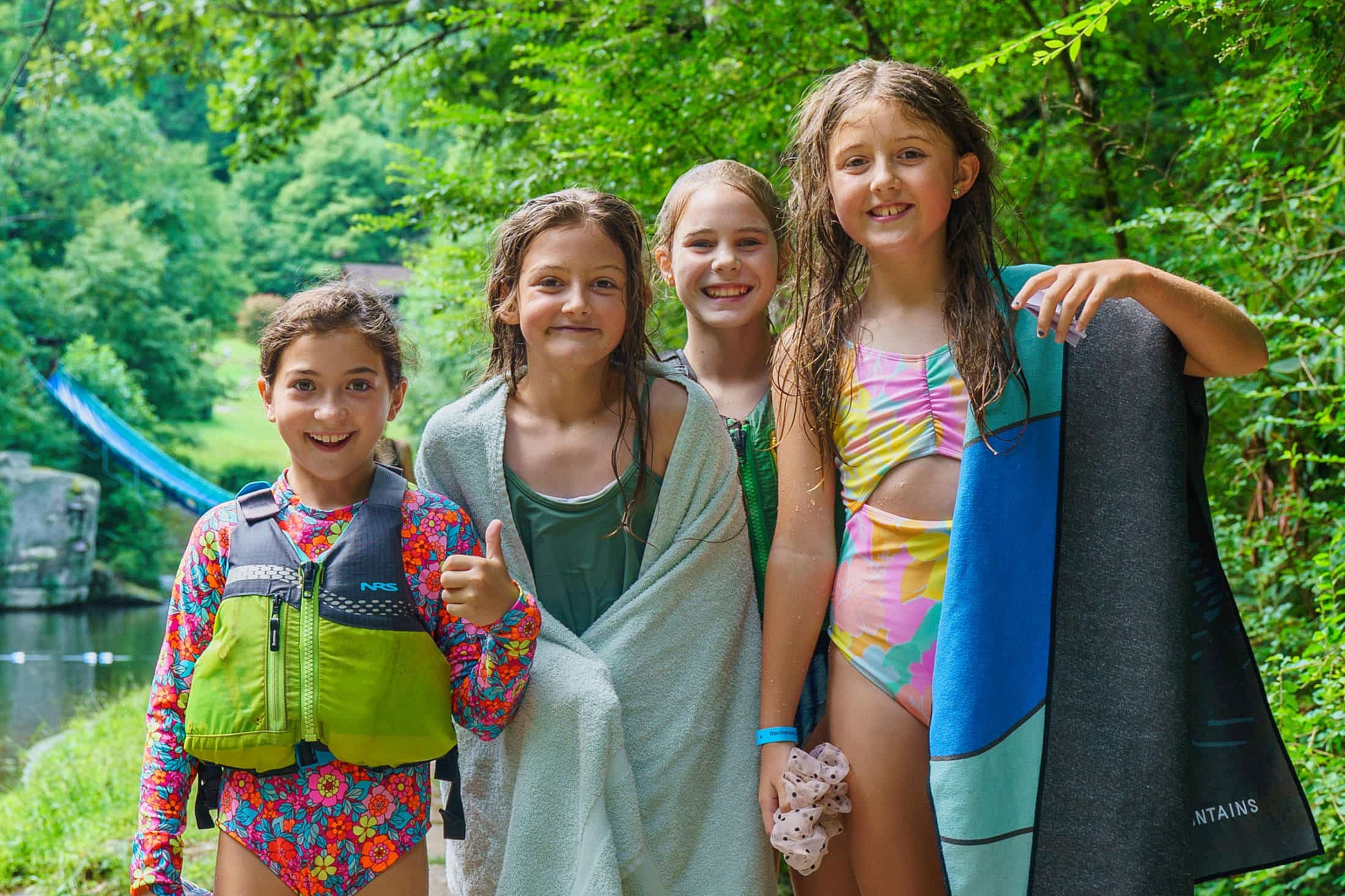 summer camp friends after swimming in lake