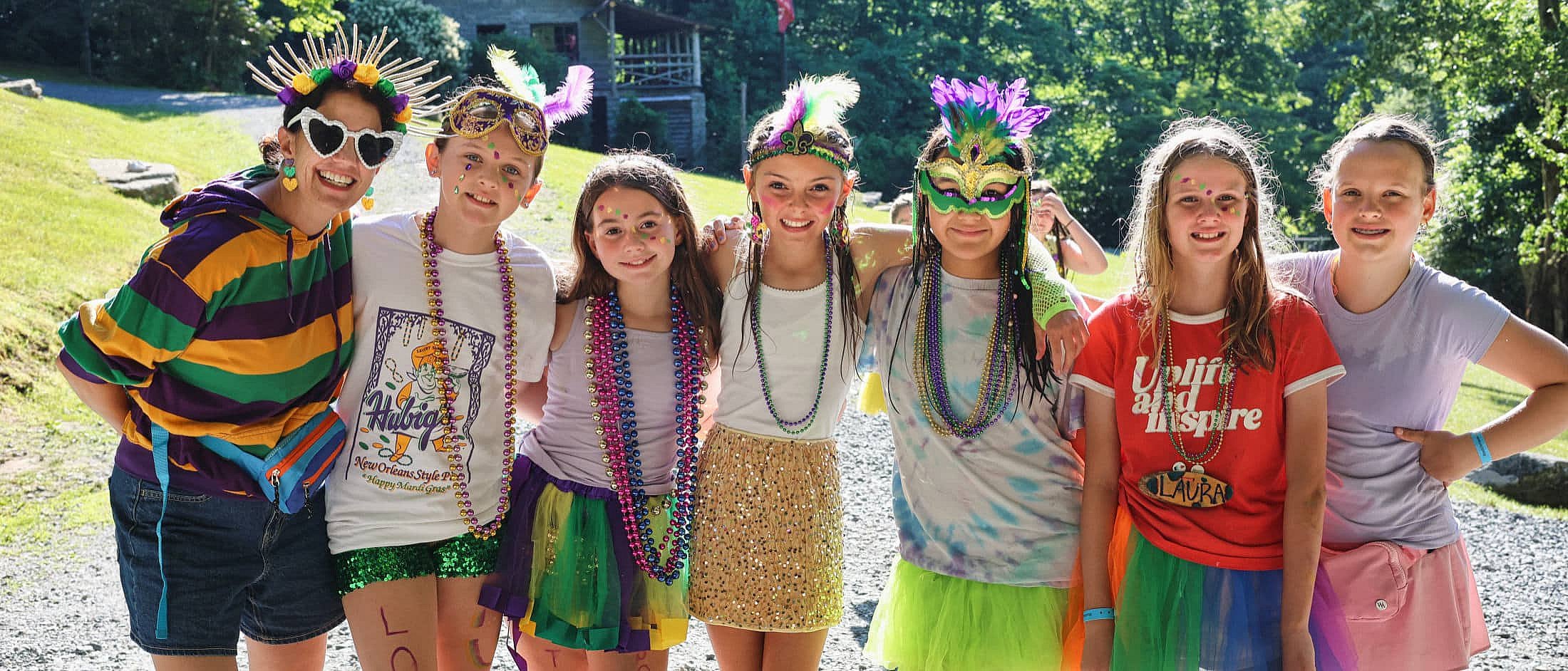 camp girls dressed for mardi gras dinner