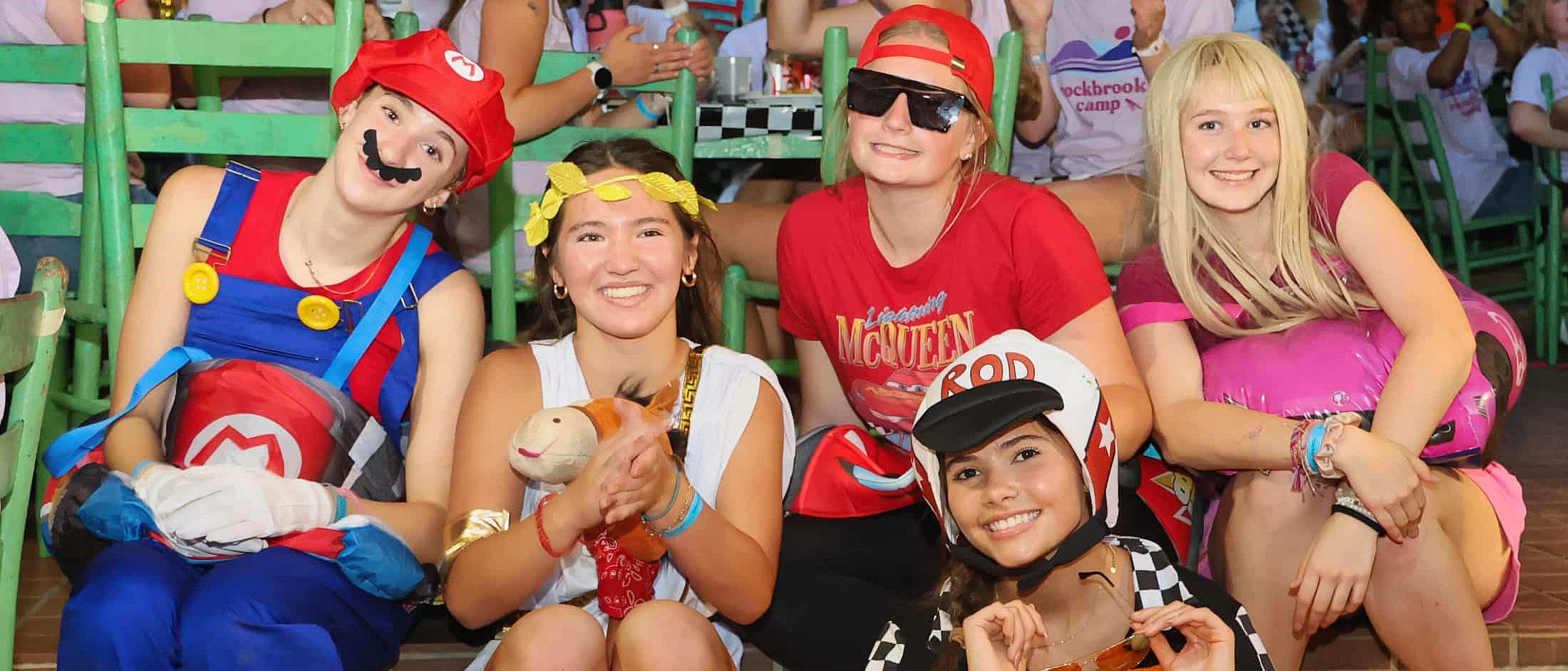 camp girls dressed in character