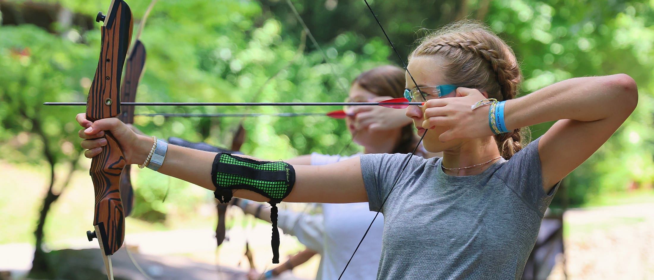 camp girl's archery concentration