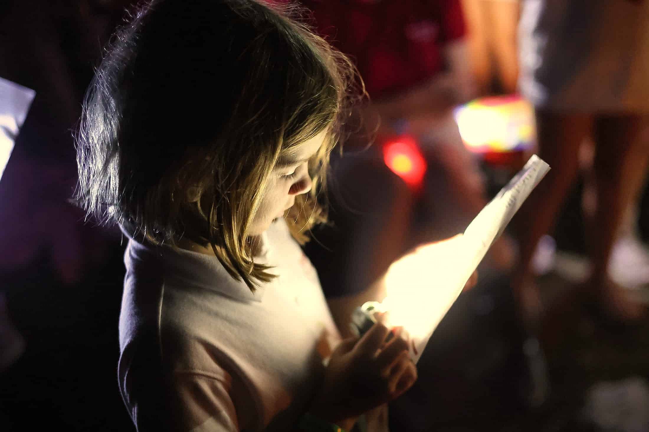 small girl at campfire camp