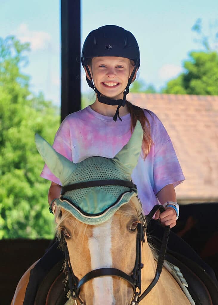 summer camp horse riding girl