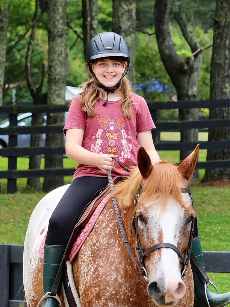 summer camp horseback riding girl