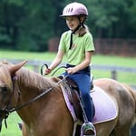 Horseback Riding Girl smiling camp girl horseback riding