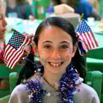 USA Flag in Hair of Girl Camper