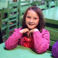 Rainy day at summer camp girl with raincoat