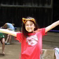 happy wide arms camp girl