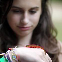 Camper kid holding newt