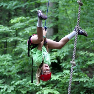 Camper upside down climbing the alpine tower