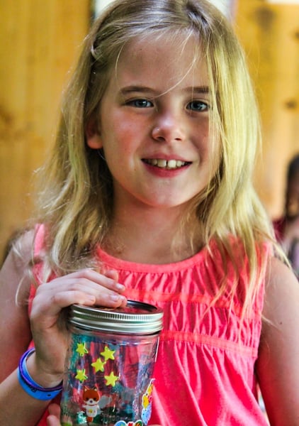 Decorated Jar held by summer camp girl
