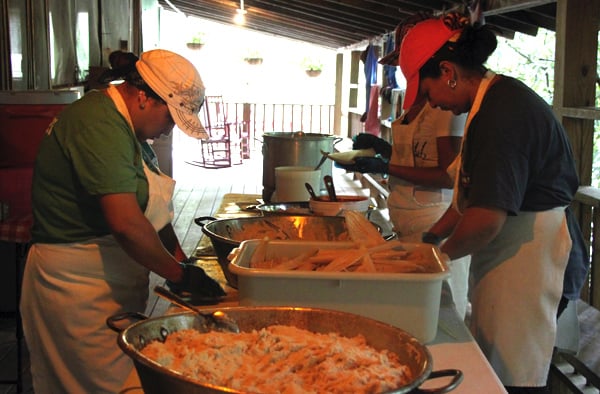 Making authentic corn tamales at camp