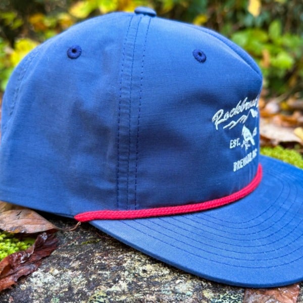 side view of navy and red cord flat-brim hat