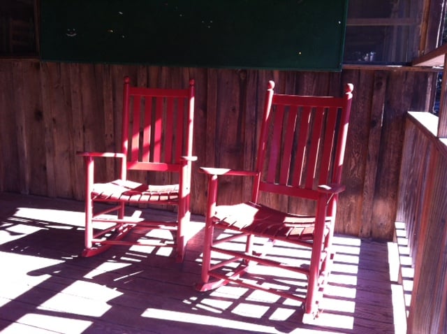 red rocking chairs at camp