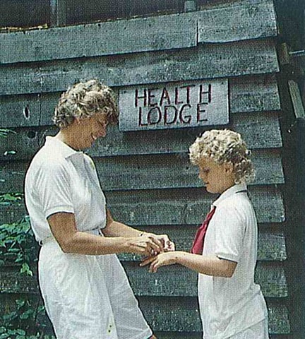 Camp Nurse helping girl