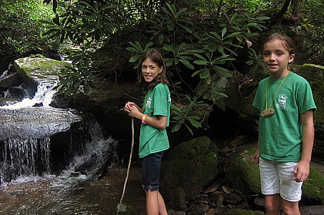 Girls finding a waterfall on hike