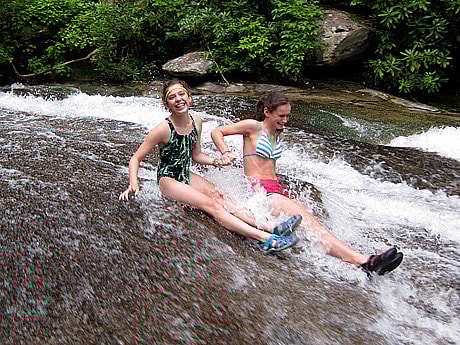 2 camp girls taking a ride down sliding rock