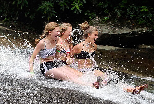 Girls Sliding Down the Rock