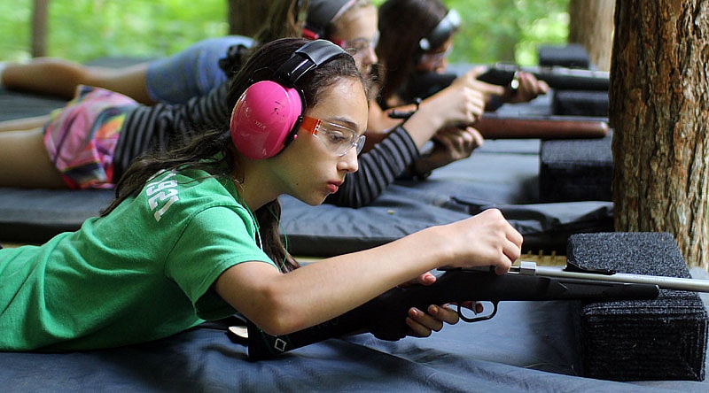 Girl Loading a Gun