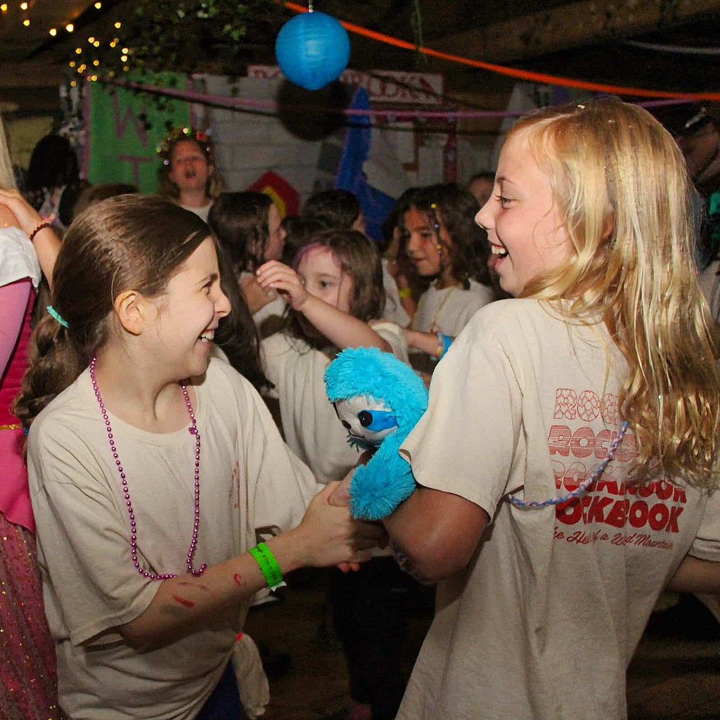 smiling camp girls dancing