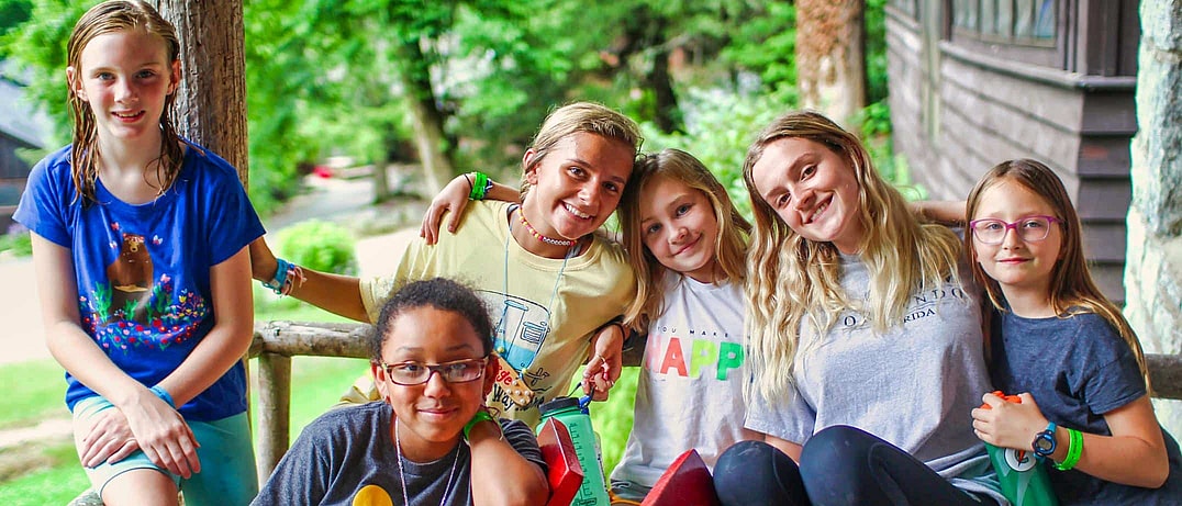 camp staff and children haning out