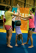 Gymnastics camper doing handstand